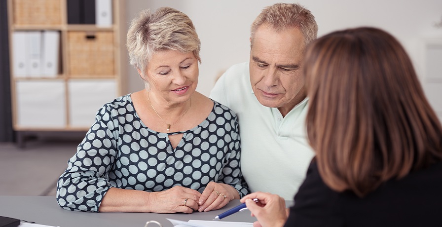 older couple being shown forms 
